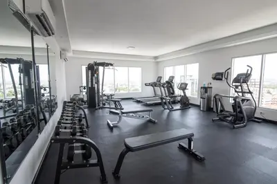 a gym with rows of treadmills and exercise machines at Exclusivo apartamento - Soha Suites II-B9 - 2 BR in Rincón Largo