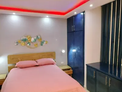 a bedroom with a bed and a red ceiling at Agréable appartement en rooftop in La Cabirma