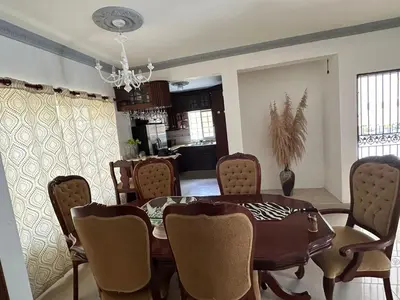 a dining room with a table and chairs at Casa completa con hermosa vista in San Felipe de Puerto Plata