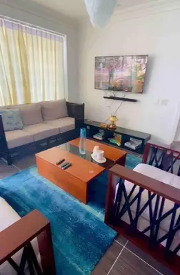 a living room with a couch and a coffee table at Ocean Front Deluxe Condo in Punta Balandra