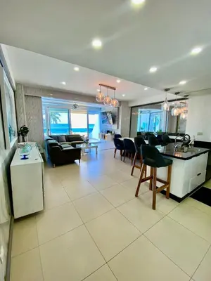 a living room with a kitchen and a dining room at LasOlasTower JuanDolio-2Br-3Bds-7Px-WiFi-SeaView in Juan Dolio