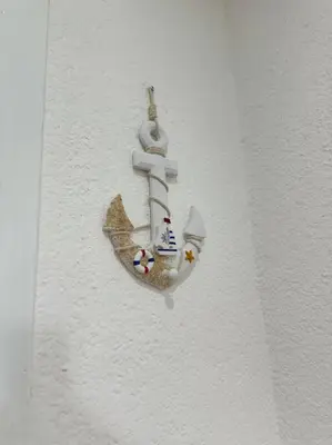 a wall with a toy ship on it at Luz de Luna Emotions in Santo Domingo