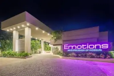 a building with a purple sign on the side of it at Luz de Luna Emotions in Santo Domingo