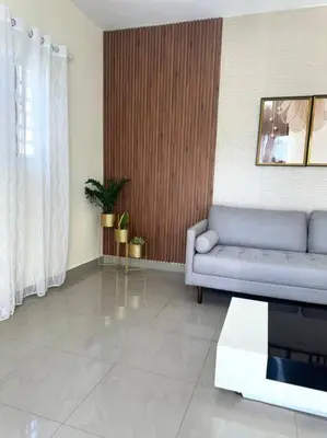 a living room with a couch and a table at Apartamento hermoso in Los Macos