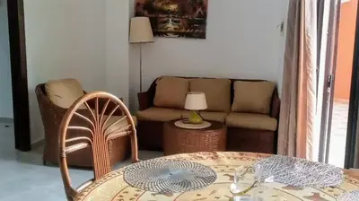 a living room with a couch and a table at Residenzia Oasis Fiordaliza in El Higo