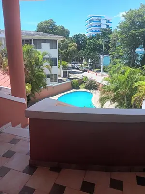 a view of the pool from the balcony of a building at Residenzia Oasis Fiordaliza in El Higo
