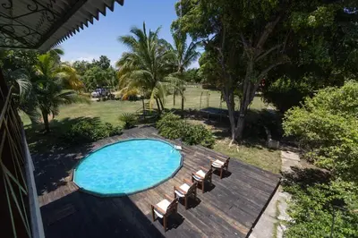 an overhead view of a swimming pool with a deck and chairs at Casa Palmar in Palmar Arriba