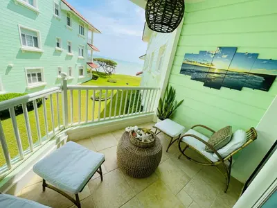 a balcony with chairs and a view of the ocean at Victorian Condominio in Cabarete