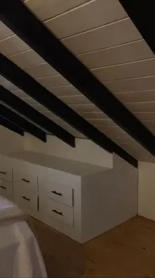 a bedroom with a bed and a ceiling at Villa Reina in Buena Vista