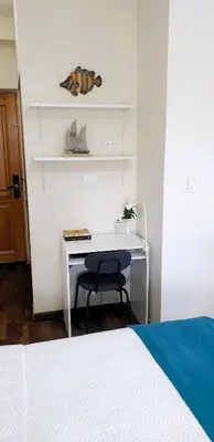 a white desk with a chair in a bedroom at Cadaques Caribe Bayahibe Private beach in Bayahibe