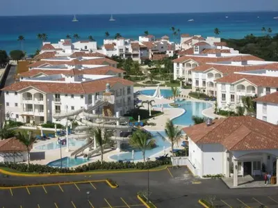 an aerial view of a resort with a water park at Cadaques Caribe Bayahibe Private beach in Bayahibe