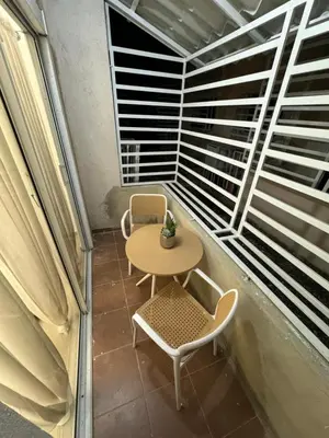 a small table and a chair on a balcony at Casa las América in La Cana