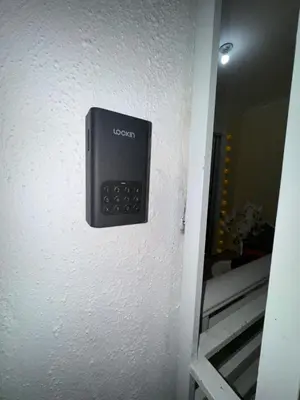 a remote control on the wall of a room at Casa las América in La Cana