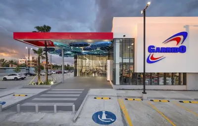 a building with a garbo sign in front of it at Casa las americas in La Cana