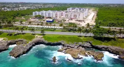 an aerial view of a resort and a river at Casa las americas in La Cana