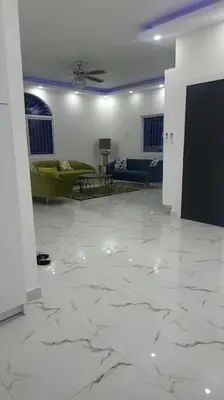 a living room with a couch and a table at Bocachica house,apts,village in Jubey