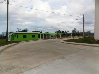 a green building on the side of a road at Cañaveral Del Mar 1 Quiet and extremally relaxing! in San Felipe de Puerto Plata