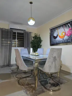 a dining room with a glass table and chairs at comodidad y tranquilidad in Mendoza