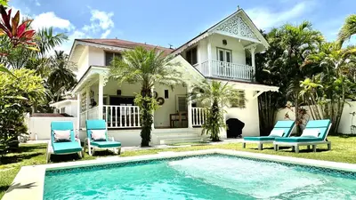 a house with a swimming pool in front of a house at Villa 4Bdrms 3.5baths with pool, Jacuzzi and Starlink WiFi in Las Terrenas