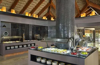 a buffet line in a restaurant with food at Paradisus Punta Cana Resort All Inclusive in Punta Cana