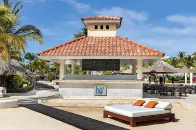 a gazebo with a bench in front of it at The Reserve at Paradisus Punta Cana - All Inclusive in Punta Cana