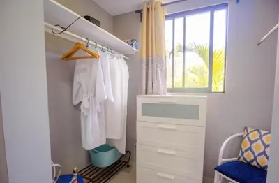a closet with a dresser and a window at Beautifully updated in the heart of town in Cabarete