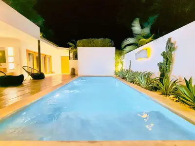 a large blue swimming pool in a house at Villa Vista in Las Terrenas