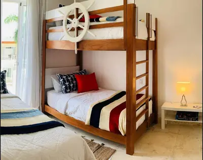a bedroom with two bunk beds and a bed at Luxury Penthouse Coson bay in Las Terrenas