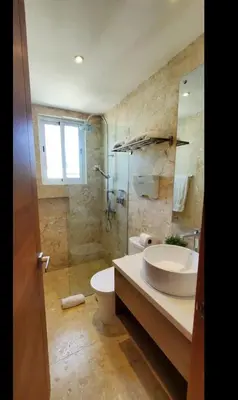 a bathroom with a sink and a shower and a toilet at Luxury Penthouse Coson bay in Las Terrenas