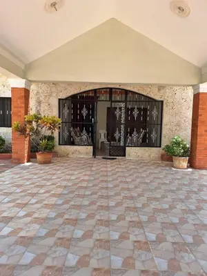 a large entry to a building with a large glass door at Casa Rural con Piscina in Azua de Compostela