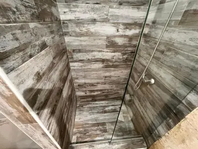 a bathroom with a shower with a glass door at Residencial Paraiso C102 in Bayahibe