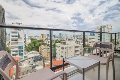 a balcony with a view of a city at Cozy, Centric 1BR Condo, Pool in Los Prados