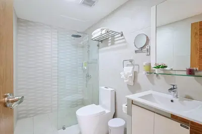 a bathroom with a toilet and a sink and a shower at Cozy, Centric 1BR Condo, Pool in Los Prados