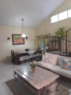 a living room with a couch and a table at Villabenedetta santo domingo in Varía