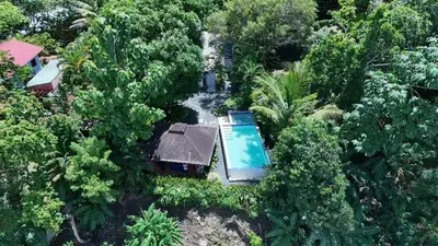 an aerial view of a house with a swimming pool at Villabenedetta santo domingo in Varía