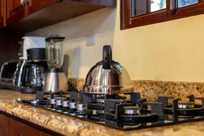 a tea kettle sitting on top of a stove at Cabarete Oceanview Villa Pool Oasis Beach Access in Cafemba