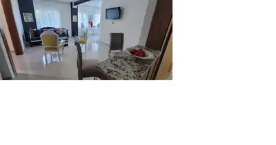 a living room with a couch and a dining room at Charming 2BR Apt Near Beach in Sabana Grande