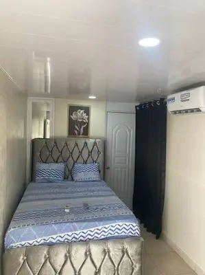 a bedroom with a large bed in a room at lugar comodo y barato in Santiago de los Caballeros