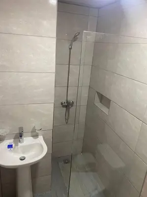a bathroom with a shower and a sink at lugar comodo y barato in Santiago de los Caballeros