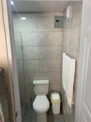 a small bathroom with a toilet and a sink at lugar comodo y barato in Santiago de los Caballeros