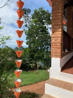 a group of orange and white vases on a building at Villa Carmen en Jarabacoa in La Represa