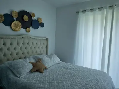 a bedroom with a bed with a starfish on it at A private cozy-beach apartment in Dominicus in La Laguna