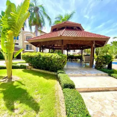 a gazebo in the backyard of a house at Apartamento en Punta Cana, White sands in Punta Cana