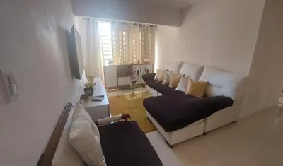 a living room with two couches and a couch at Apartamento Residencial sembrador 3 ciudad Juan Bosch in La Javilla