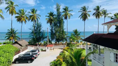 a view of the ocean from a resort at Beachfront Unit with Stunning Sunsets and Starlink Internet ! in Las Terrenas
