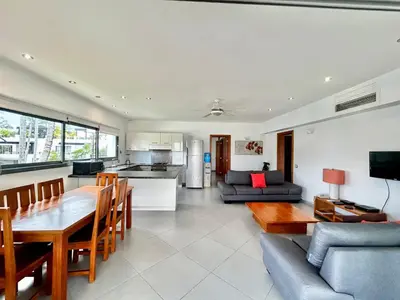 a kitchen and living room with a table and a couch at Beachfront complex 3BD 3BA with pool in Las Terrenas