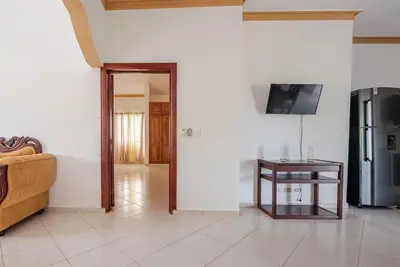 a living room with a couch and a table at Eden House in Río San Juan