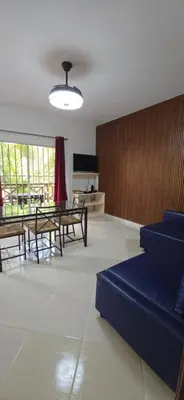 a living room with a couch and a table at Apartamentos confortables in La Barbacoa