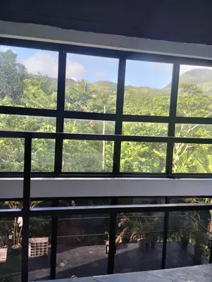 a window with a view of a forest at Casa Santa la laguna in La Aguada