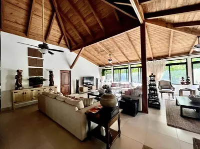 a living room with a couch and a table at Villa Cajuiles 13, Casa de Campo in La Romana